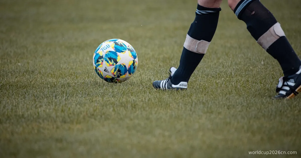 person in black and white nike soccer shoes standing on green grass field during daytime